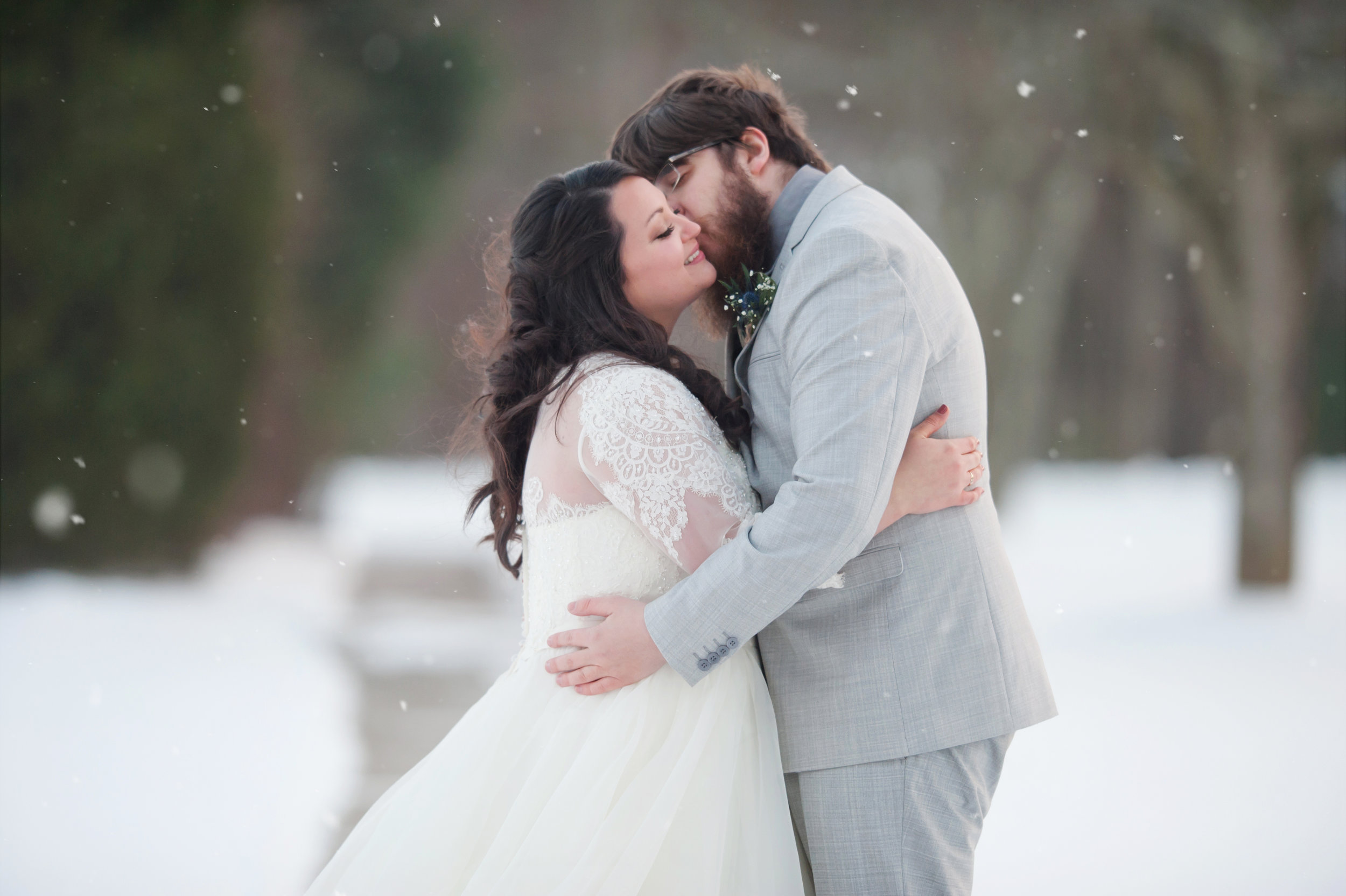  This photo may not have been taken in 2018, but I can’t think of a better way to end the year than photographing Erik and Faith’s December 27th, New England winter wedding. Although Erik is from Norwood, Massachusetts, Faith is from Atlanta, Georgia, which made their Worcester, Massachusetts wedding feel like a destination wedding. Faith was so excited to have a white Christmas and a white wedding, she and Erik braved six degree temperatures for their snowy wedding portraits! Needless to say, it was well worth it – so dreamy! 